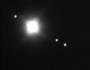 © Christoph Lohuis; Jupiter mit Ganymed, Io und Europa, 15. November 2000, 400 mm Newton f/5, 1 Sekunde, AGFA XRG 100, Ort: Neuenhaus